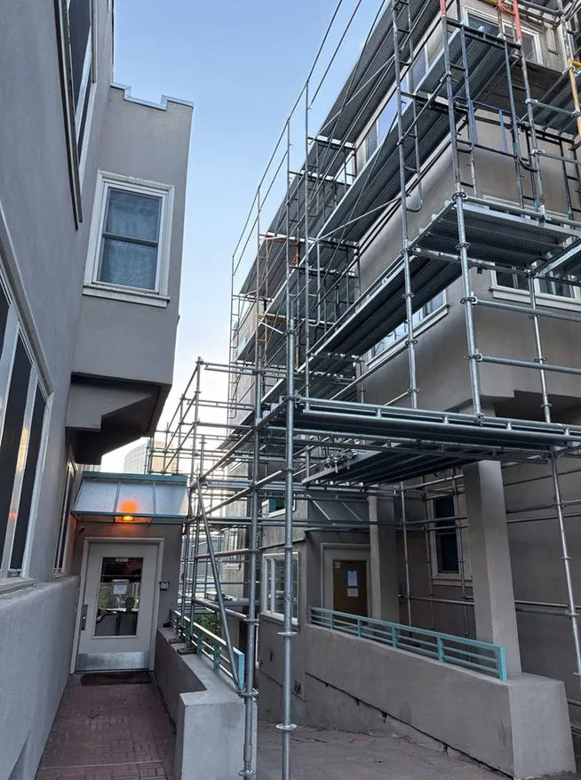 Fremont Scaffolding Rental multi level scaffolding setup in narrow residential building space