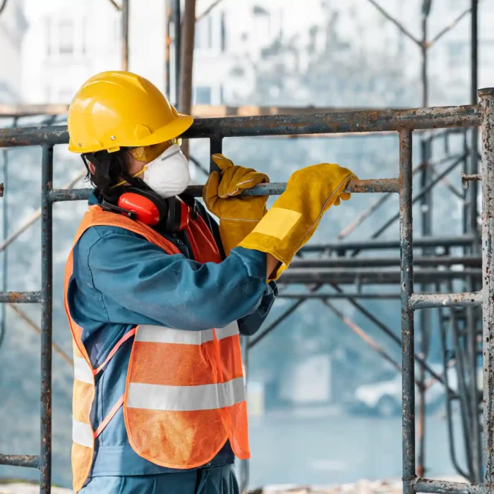 Fremont Scaffolding Rental worker installing scaffolding equipment wearing safety gear and helmet